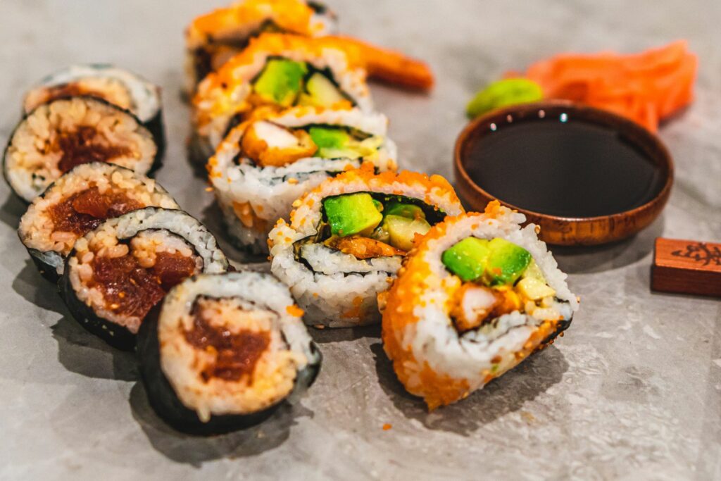 An Authentic and Delightful Sushi Experience - Sushi rolls with soy sauce